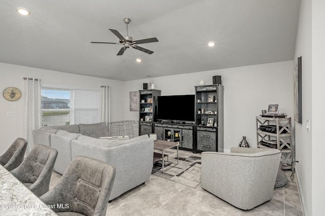 living room featuring recessed lighting, a ceiling fan, and vaulted ceiling