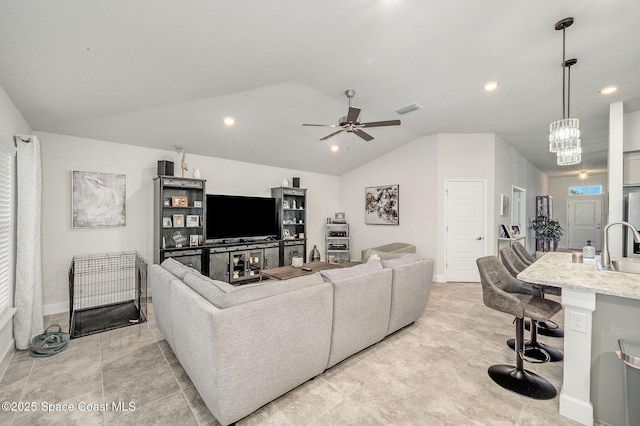 living area featuring baseboards, visible vents, lofted ceiling, recessed lighting, and ceiling fan