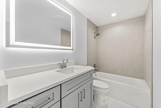 full bathroom with vanity, shower / bathing tub combination, toilet, and marble finish floor