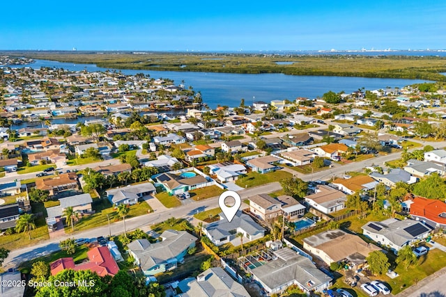 drone / aerial view with a residential view and a water view