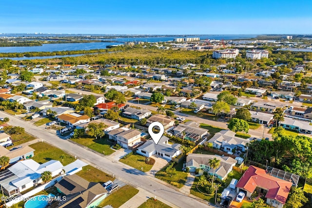 birds eye view of property featuring a water view and a residential view