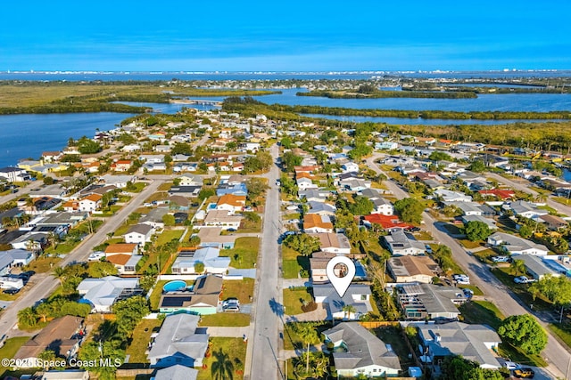 aerial view with a residential view and a water view