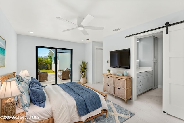 435 Patrick Ave, Merritt Island, FL 32953 - bedroom with ensuite bathroom, visible vents, ceiling fan, a barn door, and access to exterior