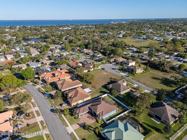 bird's eye view featuring a residential view and a water view