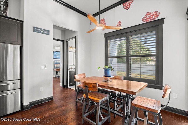 dining space featuring dark wood-style floors, ceiling fan, and baseboards