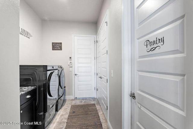 laundry area featuring washer and dryer and laundry area