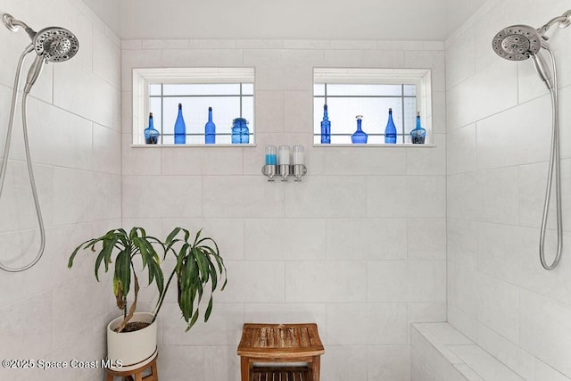 full bath featuring tiled shower