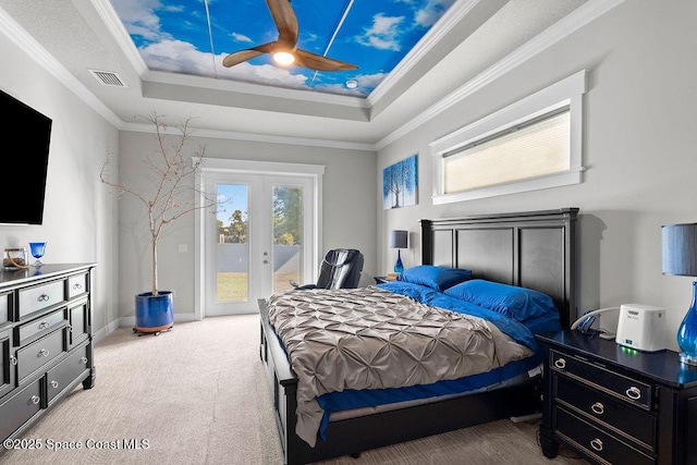 bedroom with visible vents, light carpet, a tray ceiling, french doors, and access to exterior