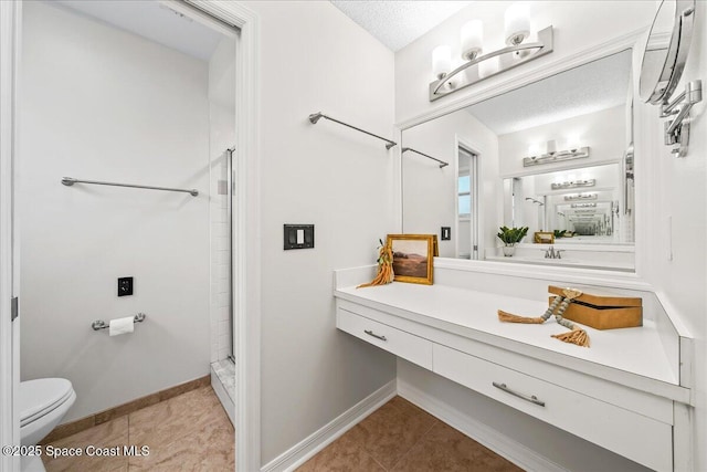 bathroom with vanity, toilet, a stall shower, and tile patterned flooring