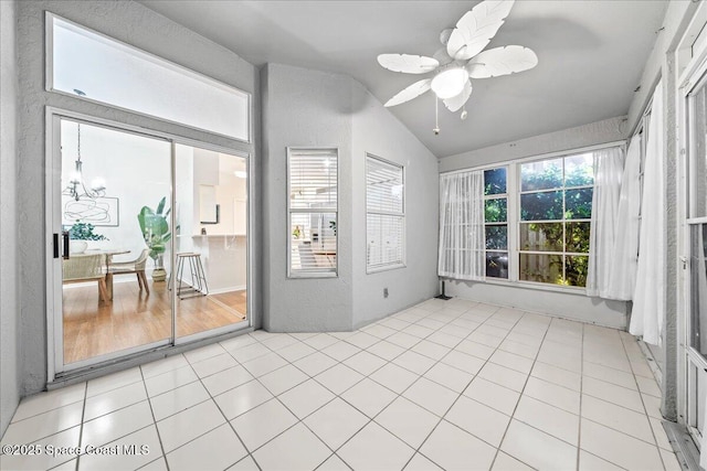 sunroom / solarium featuring a ceiling fan and vaulted ceiling