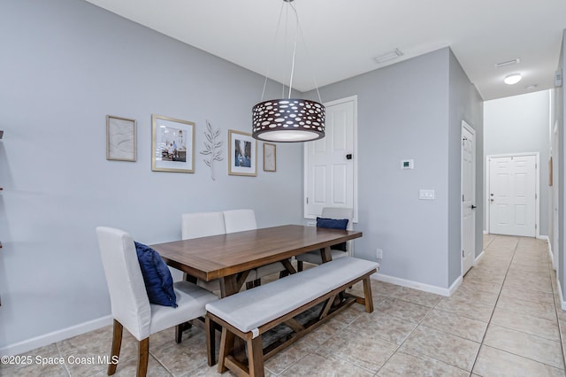 2705 Revolution St Unit 106, Melbourne, FL 32935 - dining space featuring light tile patterned floors and baseboards