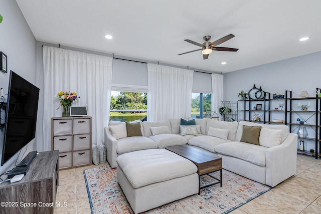 2705 Revolution St Unit 106, Melbourne, FL 32935 - living area with light tile patterned flooring, recessed lighting, and a ceiling fan