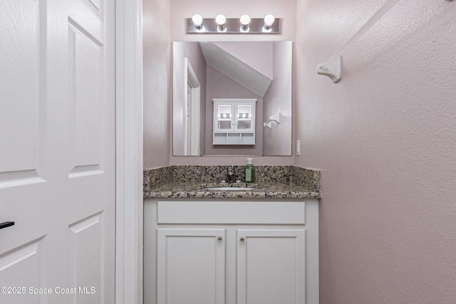 2705 Revolution St Unit 106, Melbourne, FL 32935 - bathroom featuring vanity and a textured wall