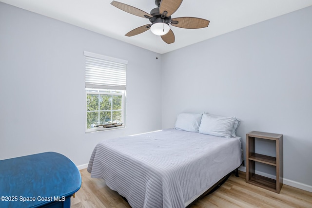 2705 Revolution St Unit 106, Melbourne, FL 32935 - bedroom featuring light wood-style flooring, a ceiling fan, and baseboards