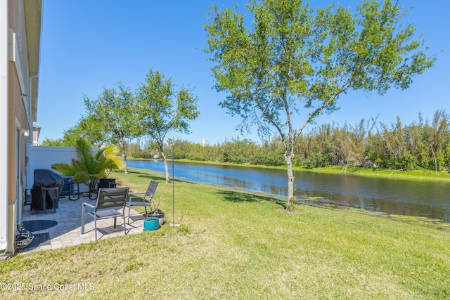 2705 Revolution St Unit 106, Melbourne, FL 32935 - view of yard featuring a water view and a patio area