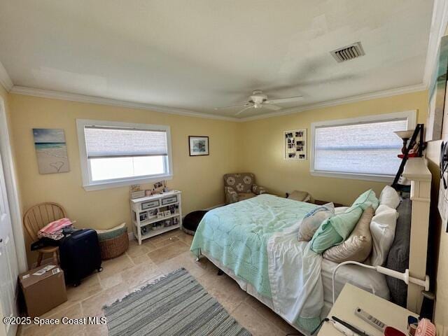 bedroom with visible vents, stone finish floor, a ceiling fan, and ornamental molding