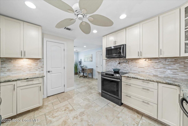 380 Greenway Ave, Satellite Beach, FL 32937 - kitchen with visible vents, stone tile floors, recessed lighting, appliances with stainless steel finishes, and a ceiling fan