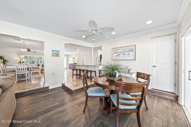 380 Greenway Ave, Satellite Beach, FL 32937 - dining space with a ceiling fan, dark wood-style floors, baseboards, and ornamental molding