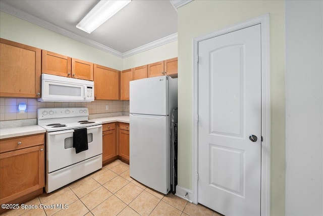 kitchen featuring light tile patterned floors, white appliances, tasteful backsplash, and crown molding