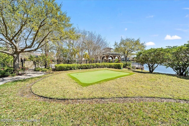 surrounding community featuring a gate and fence