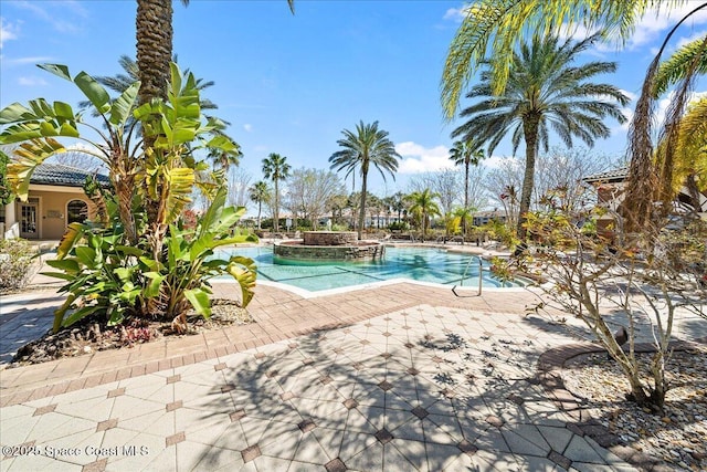 view of swimming pool featuring a patio area