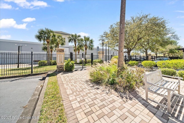 view of property's community featuring fence