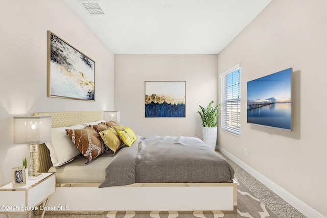 bedroom with visible vents, baseboards, and carpet floors