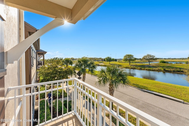 balcony featuring a water view