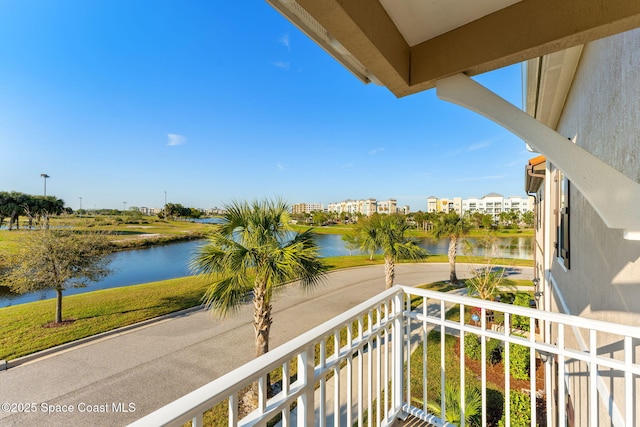 balcony featuring a water view