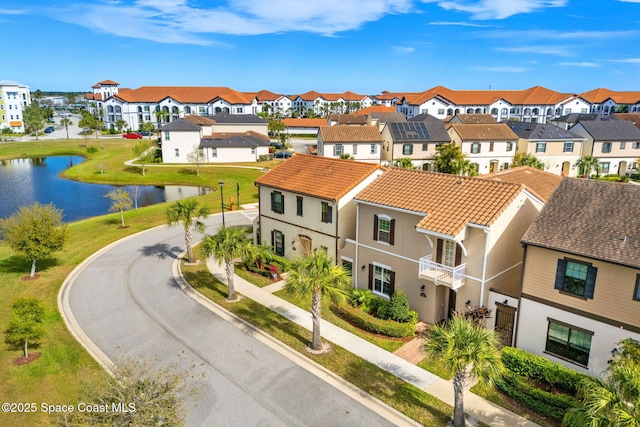 aerial view with a residential view and a water view