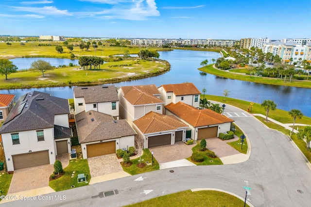 bird's eye view with a water view and a residential view