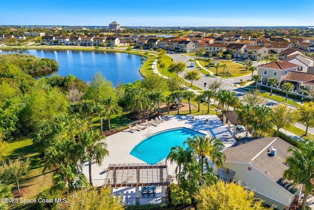 birds eye view of property with a residential view and a water view