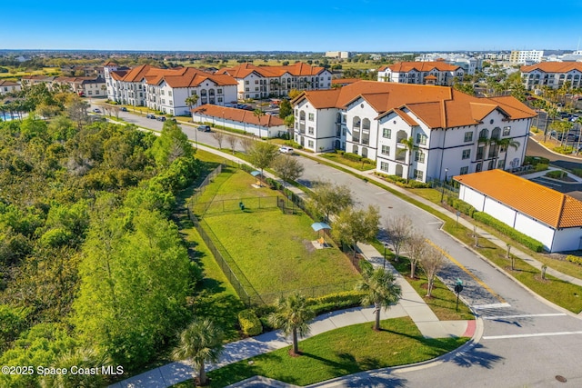 birds eye view of property with a residential view