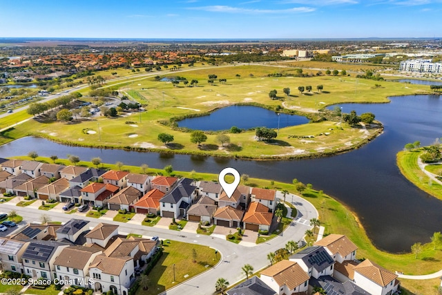 aerial view with a residential view and a water view