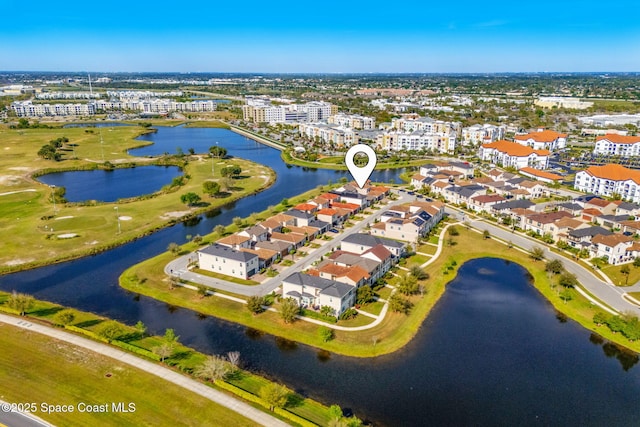 drone / aerial view with a residential view and a water view