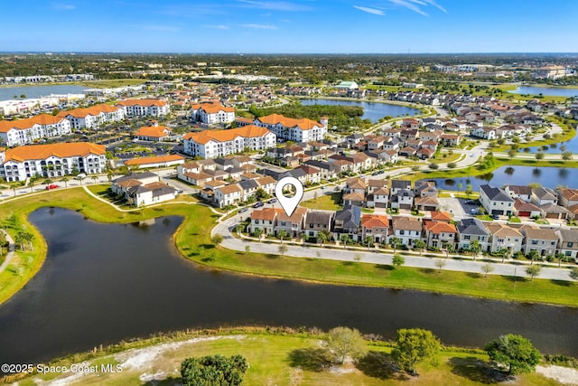 birds eye view of property featuring a residential view and a water view