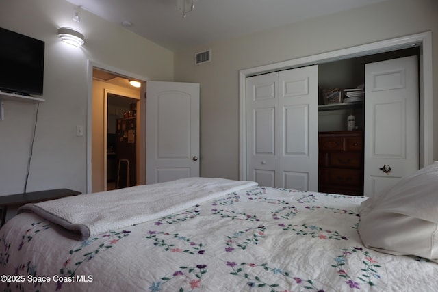 bedroom featuring a closet and visible vents