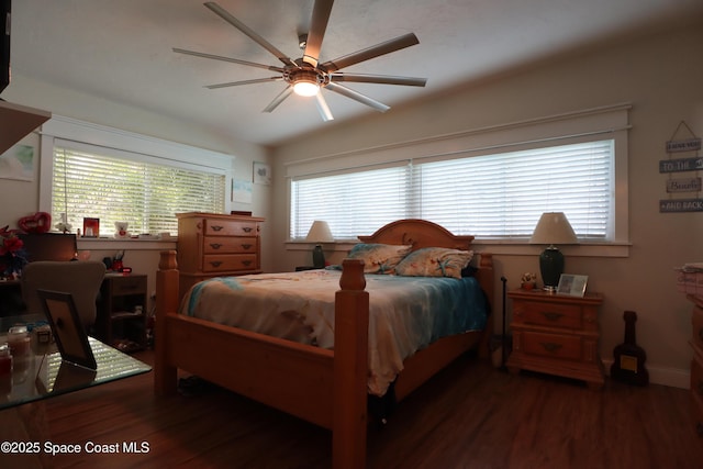 bedroom featuring vaulted ceiling, a ceiling fan, and wood finished floors