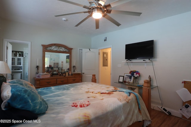 bedroom featuring wood finished floors, visible vents, and ceiling fan