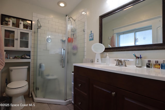 full bath with vanity, recessed lighting, a stall shower, tile patterned flooring, and toilet