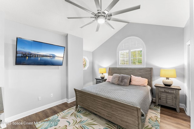 bedroom with ceiling fan, baseboards, lofted ceiling, and wood finished floors