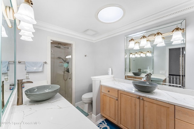 full bath with vanity, baseboards, a tile shower, ornamental molding, and toilet