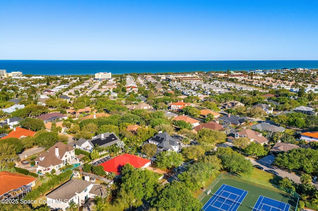 drone / aerial view featuring a water view and a residential view