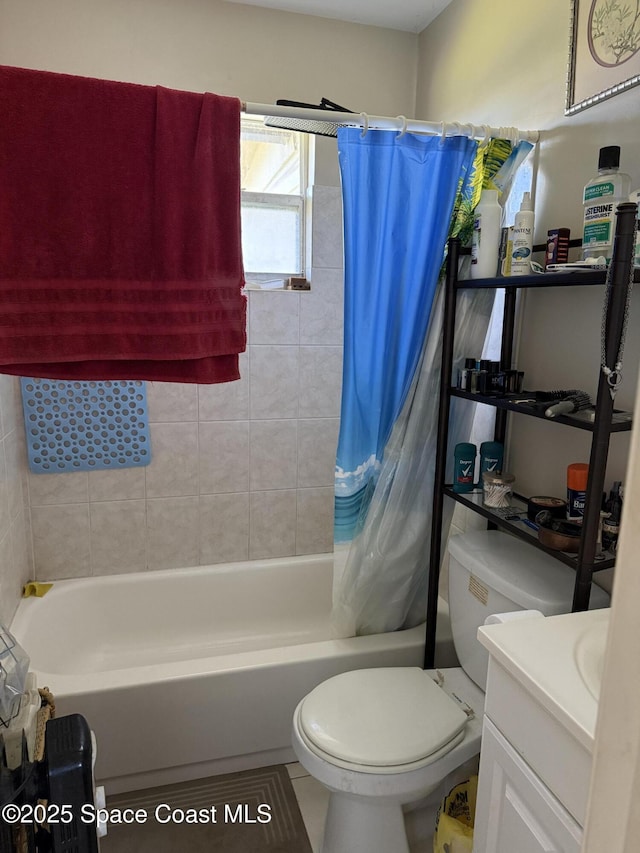 bathroom with vanity, toilet, and shower / tub combo with curtain