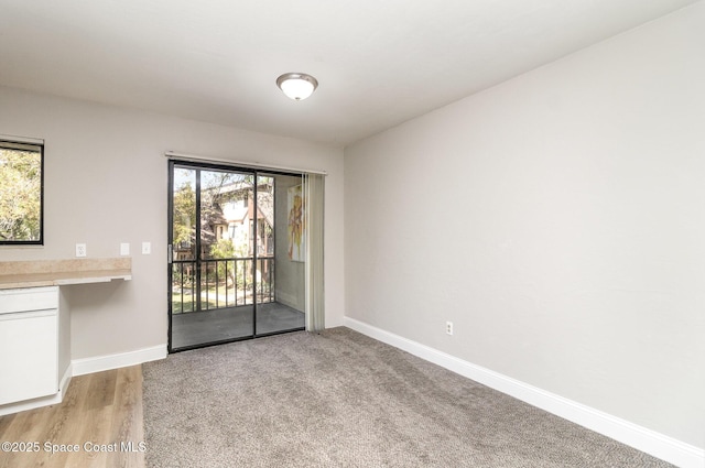 unfurnished dining area featuring baseboards and a healthy amount of sunlight