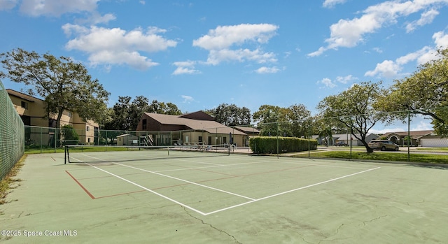 view of sport court with fence