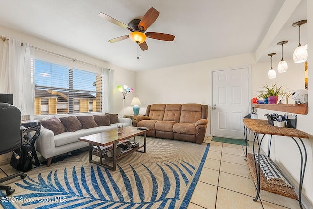 living area featuring light tile patterned floors and a ceiling fan