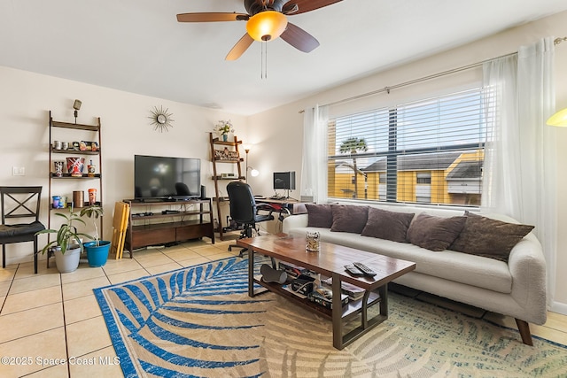 living room with ceiling fan and light tile patterned flooring