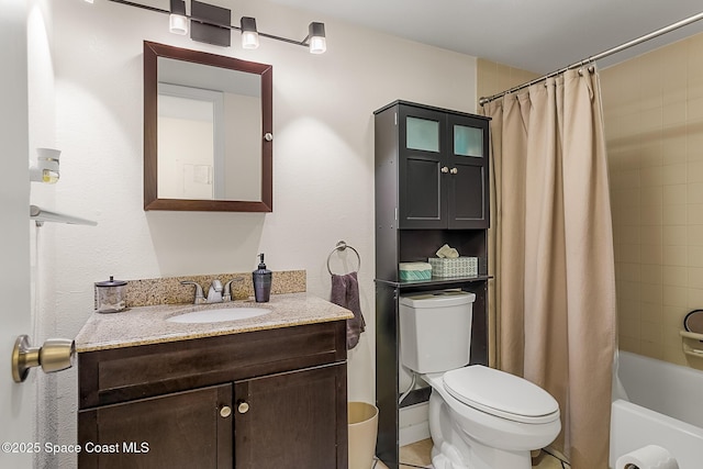 bathroom featuring vanity, toilet, and shower / tub combo with curtain