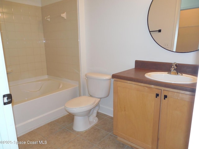 bathroom with vanity, baseboards, tile patterned flooring, bathtub / shower combination, and toilet